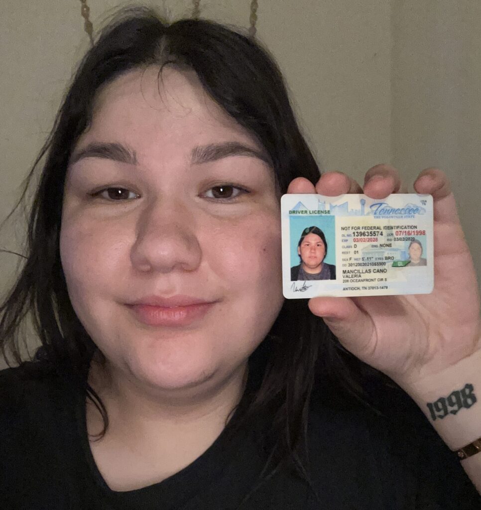 Selfie holding company ID example